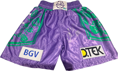 Oleksandr Usyk hand signed boxing shorts in a striking purple and green colour scheme with a bold silver autograph.