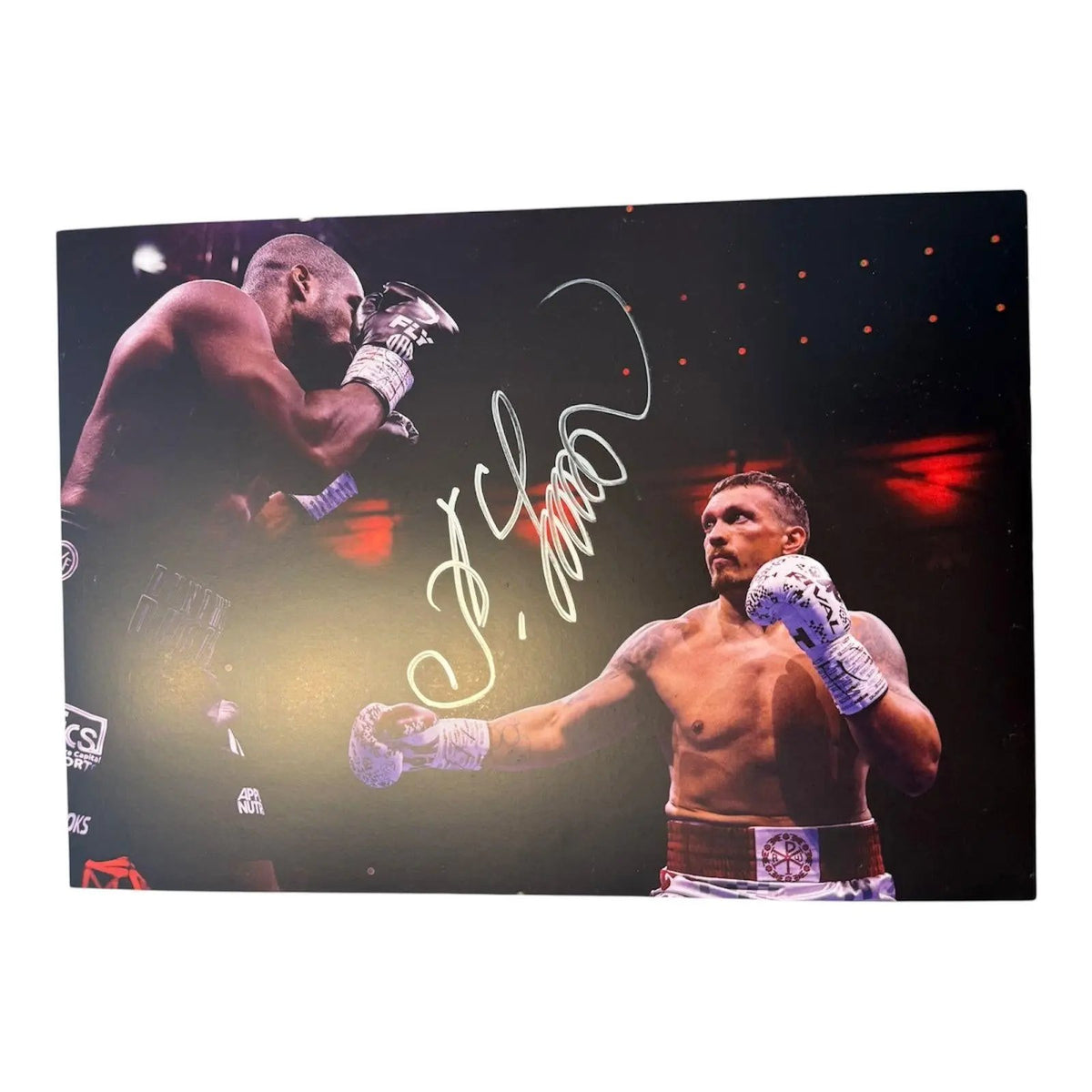 Signed Oleksandr Usyk photo from the Daniel Dubois II fight featuring a large hand-signed autograph in permanent marker across the action photograph