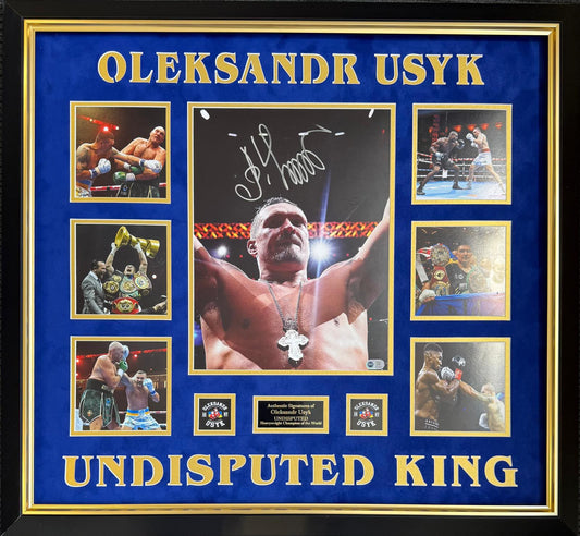 Oleksandr Usyk signed photo montage featuring central arms aloft photo, 6 career images, bespoke plaque, and blue matting with Oleksandr Usyk Undisputed King cut out.