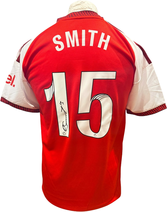 Rear view of a replica Arsenal Women 2026/2027 home shirt hand-signed by forward Olivia Smith, displayed alongside the Certificate of Authenticity.