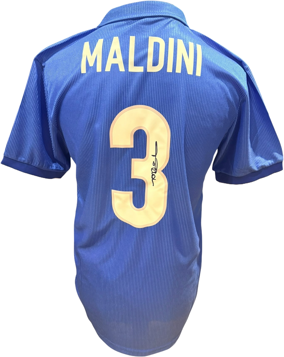 Rear view of a replica 1998 Italy home shirt hand-signed on the back number by defender Paolo Maldini, displayed alongside the Certificate of Authenticity.