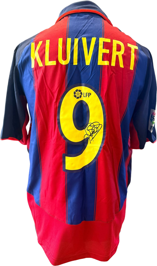 Unframed Patrick Kluivert hand-signed retro Barcelona shirt displaying the clear signature on the classic blue and red fabric.