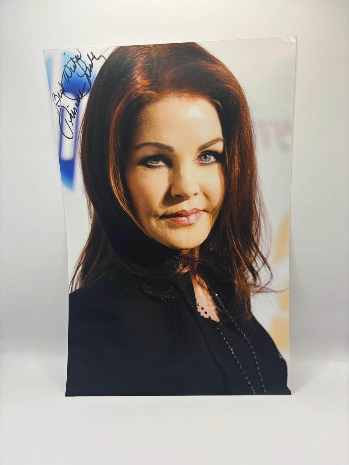 Authentic high-gloss photograph of Priscilla Presley, hand-signed by the actress in bold ink with an official Limelight Memorabilia COA.