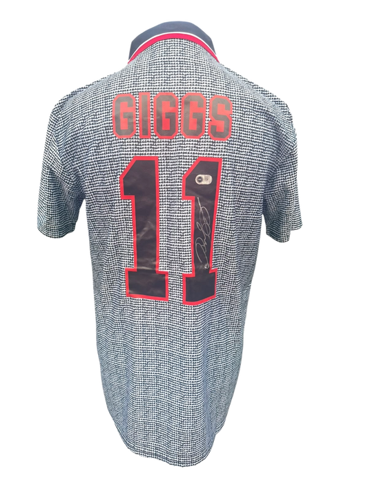 Back view of an infamous grey 1995/96 Manchester United away shirt hand-signed directly on the squad number by Ryan Giggs.