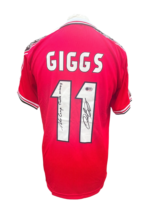 Back view of a 1998/99 Treble winning Manchester United home shirt hand-signed directly on the squad number with a Nou Camp Treble Winners inscription by Ryan Giggs.