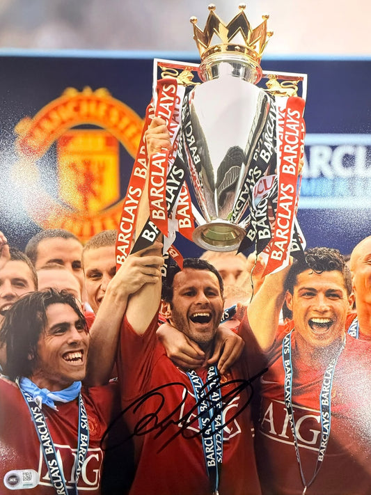 Ryan Giggs celebrating with the Premier League trophy in 2008, hand-signed in permanent marker.