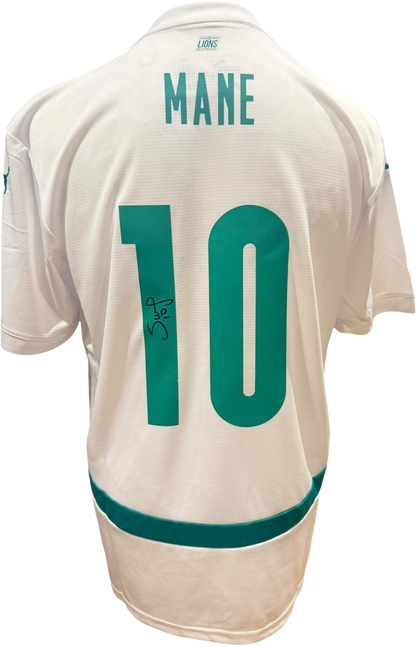 Rear view of a replica Senegal home shirt hand-signed by winger Sadio Mane, displayed alongside the Certificate of Authenticity.