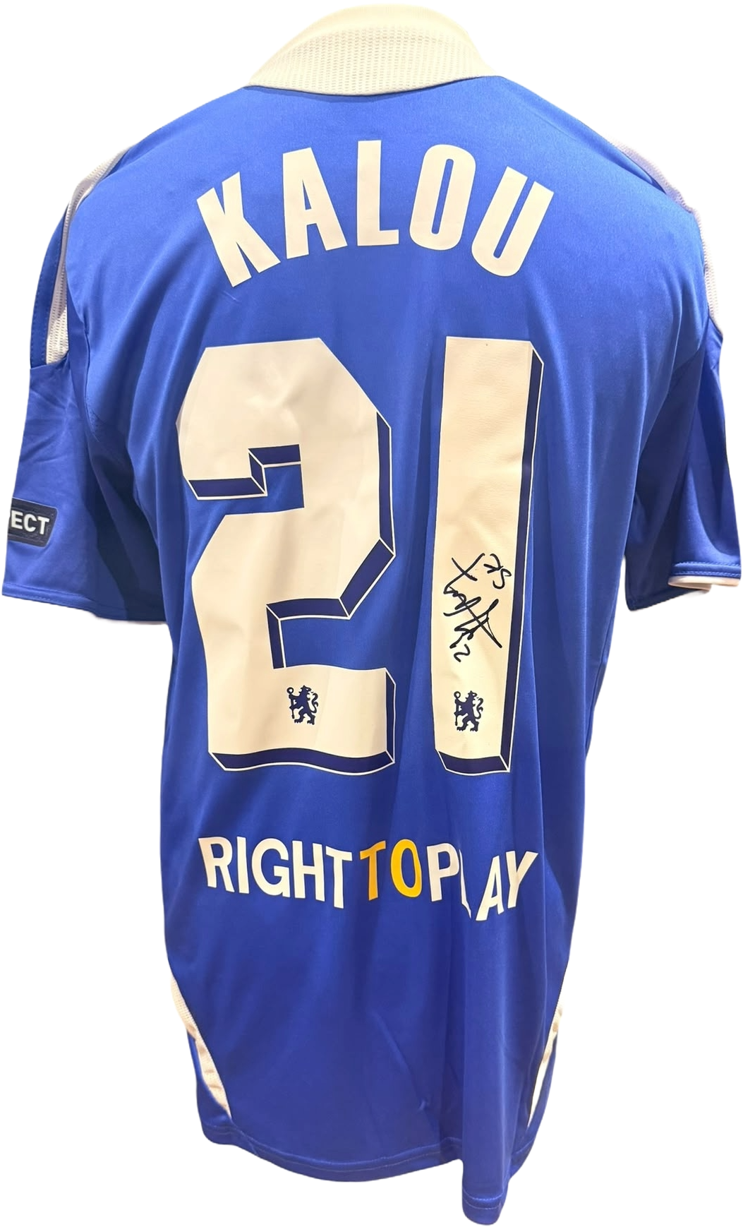 Rear view of a replica 2011/12 Chelsea home shirt hand-signed by forward Salomon Kalou, displayed alongside the Certificate of Authenticity.