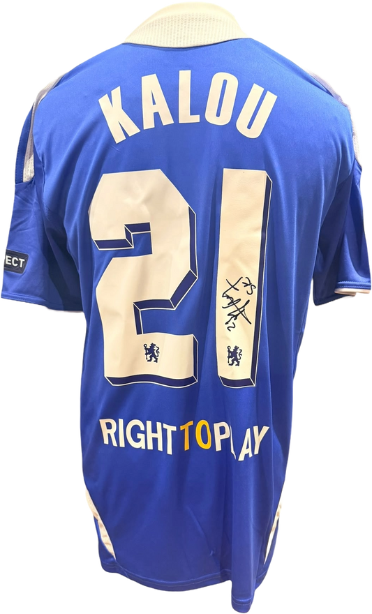 Rear view of a replica 2011/12 Chelsea home shirt hand-signed by forward Salomon Kalou, displayed alongside the Certificate of Authenticity.