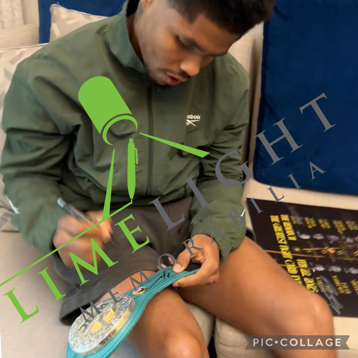 Shakur Stevenson in a private signing session, hand-signing a green WBC mini championship belt with a silver permanent marker.