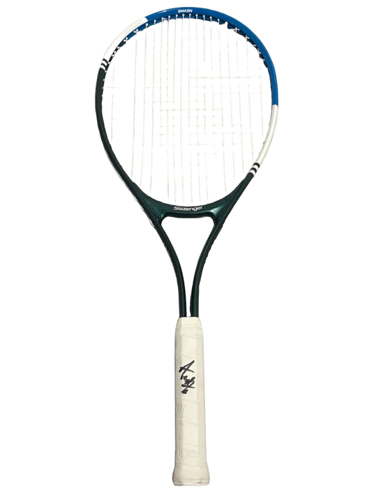 Full view of the signed Andre Agassi tennis racket showcasing the hand-signed autograph clearly across the handle grip