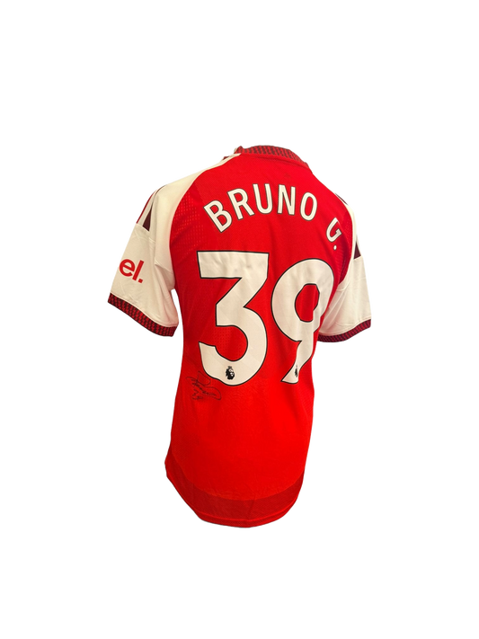Close up angle of the Bruno Guimarães signature on the 2026/27 Arsenal home shirt