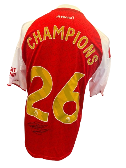 Hand-signed Declan Rice Arsenal 2025/2026 home shirt with authentic autograph and commemorative gold Champions 26 printing on the back.