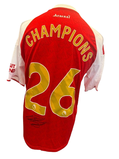 Hand-signed Declan Rice Arsenal 2025/2026 home shirt with authentic autograph and commemorative gold Champions 26 printing on the back.