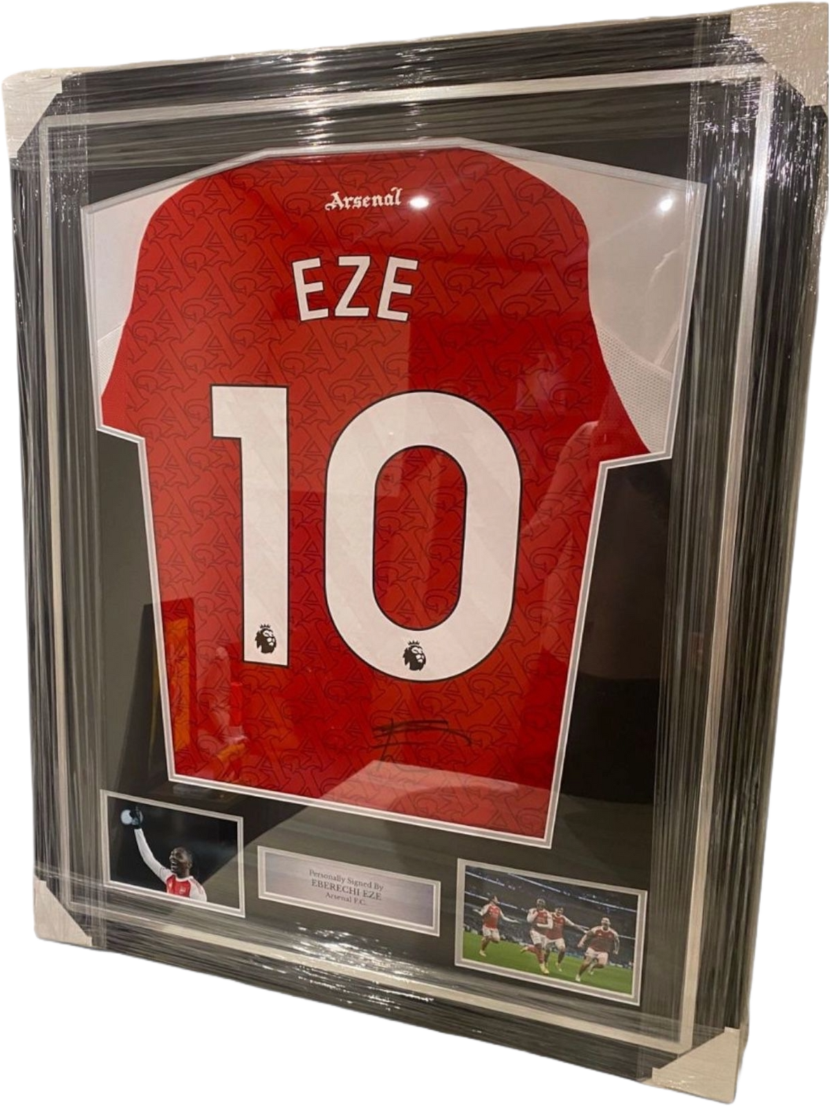 Framed and hand-signed Eberechi Eze Arsenal 2025/2026 home shirt featuring authentic autograph and inset images celebrating goals against Tottenham.