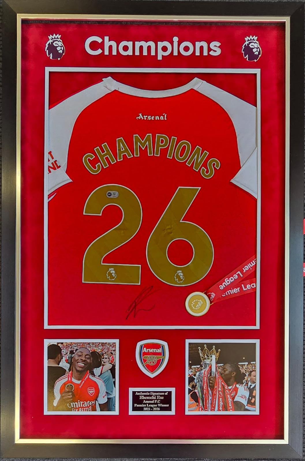Premium framed display featuring a hand-signed Eberechi Eze Arsenal home shirt with gold Champions 26 lettering on the back.