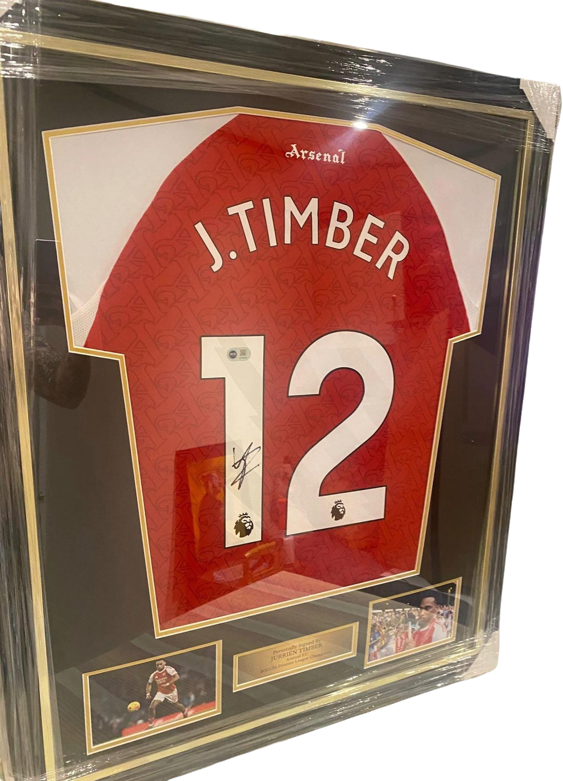 Professionally framed and authentic hand-signed Jurrien Timber Arsenal home jersey from the title-winning 2025/26 season.