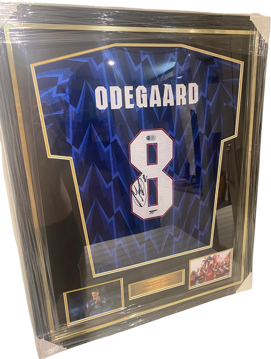 Professionally framed and authentic hand-signed Martin Odegaard Arsenal away jersey from the title-winning 2025/26 season.