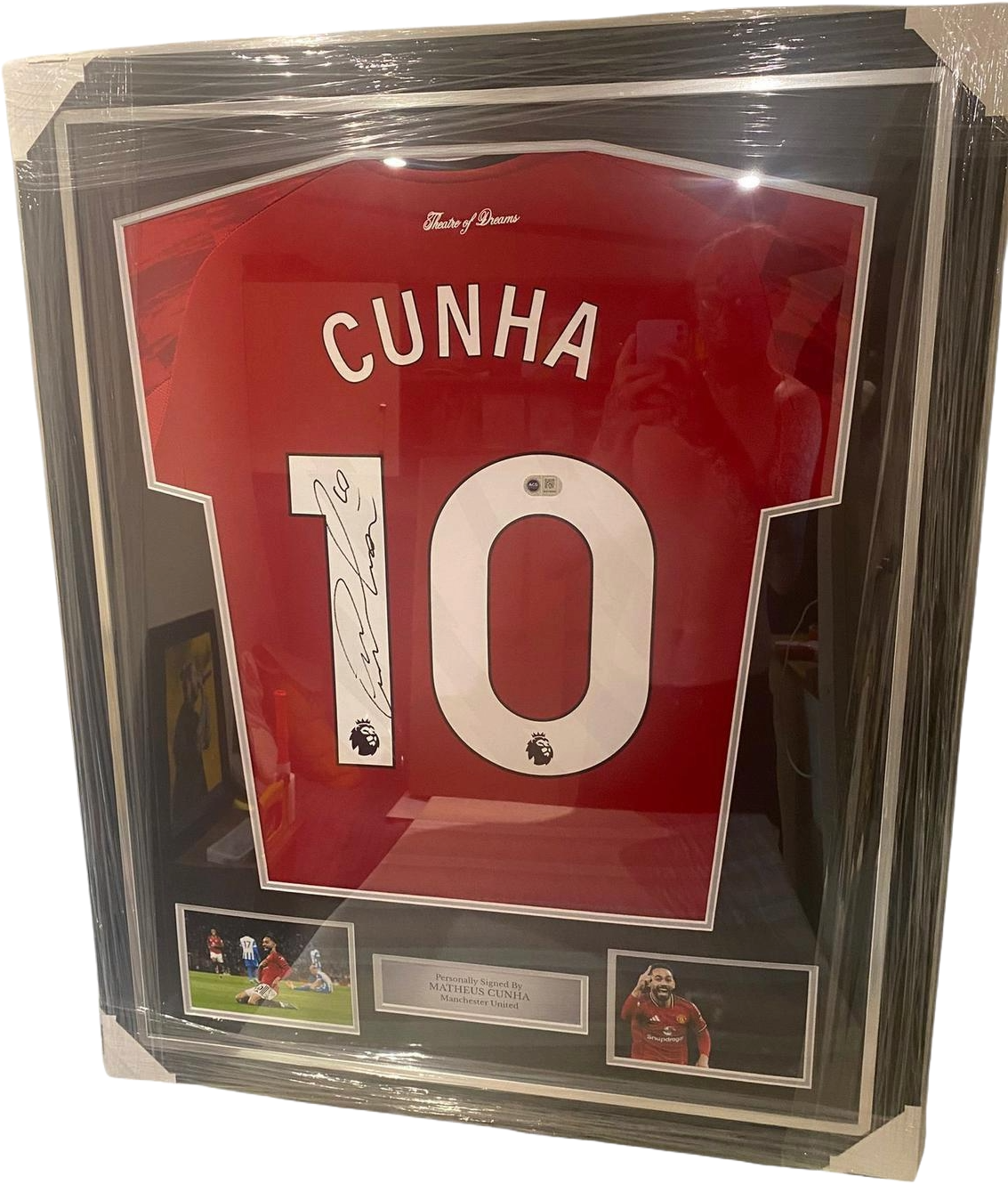 Professionally framed and authentic hand-signed Matheus Cunha Manchester United home jersey featuring a large signature across the back shirt number.
