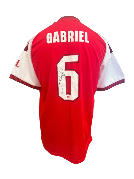 Back view of the signed Gabriel Magalhães Arsenal home shirt 2026/27 displaying player name and squad number in club font with autograph