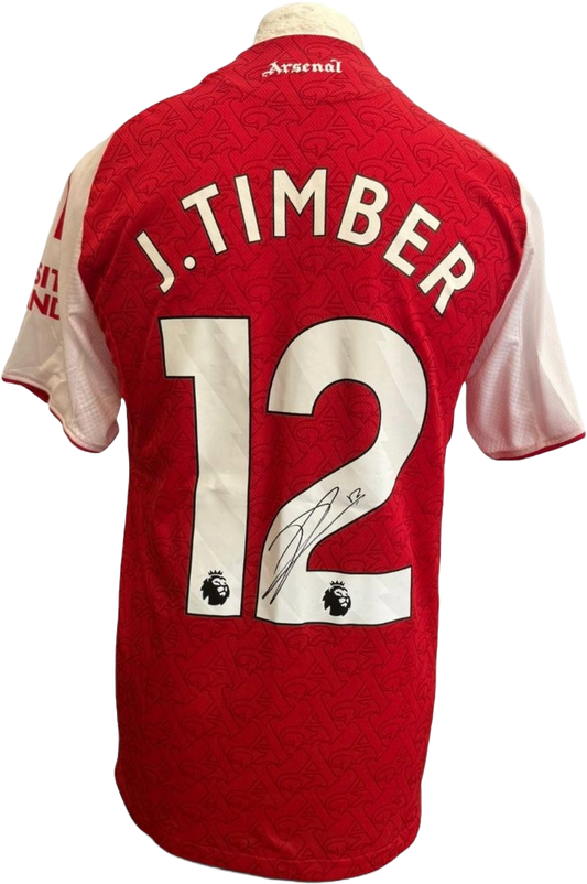 Authentic hand-signed Jurrien Timber Arsenal home jersey from the 2025/26 season featuring a clear signature on the front.