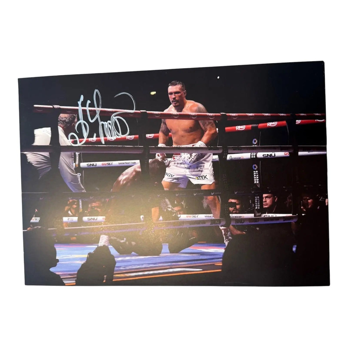 Signed Oleksandr Usyk photo depicting the knockout action during the Dubois II fight with a bold hand-signed autograph across the image