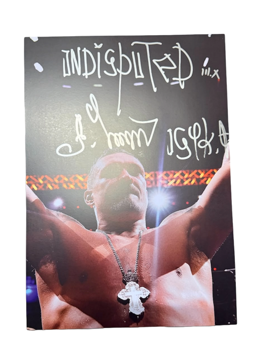 Signed Oleksandr Usyk photo displaying a large hand-signed autograph alongside a handwritten Undisputed Usyk message across the image