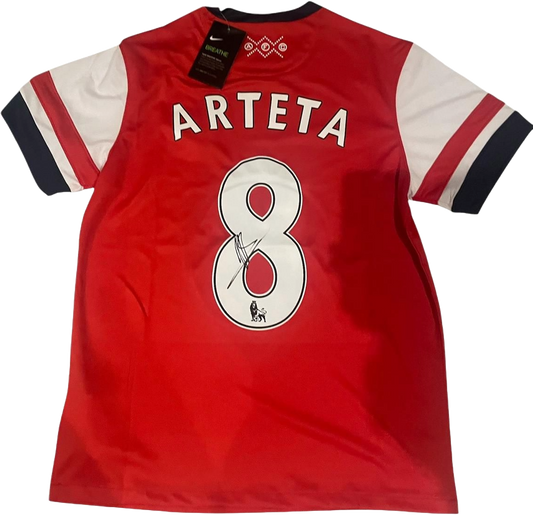 Hand-signed retro Mikel Arteta Arsenal home shirt from the 2012-14 seasons featuring a bold authentic autograph on the front.