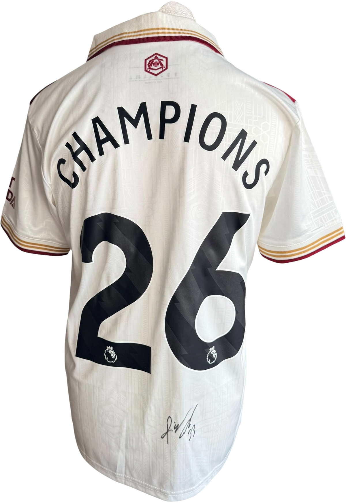 Authentic hand-signed Riccardo Calafiori Arsenal third jersey featuring Champions 26 custom printing and a clear signature on the back.