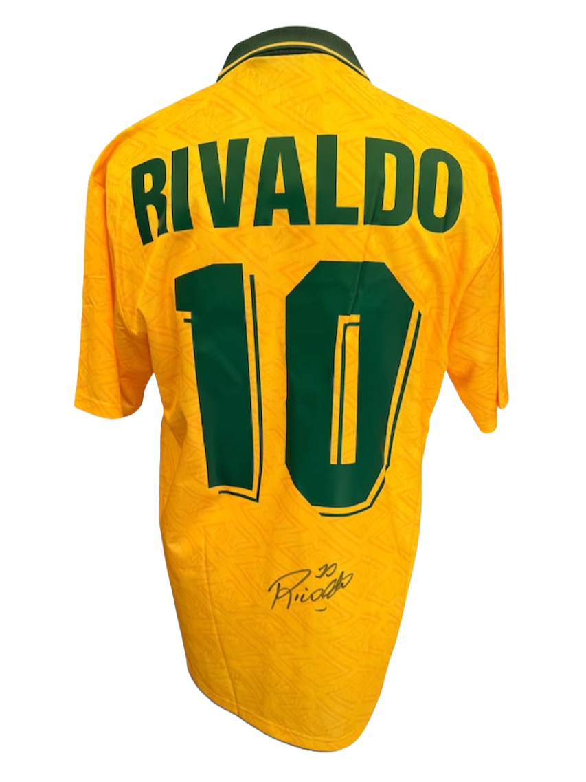 Back view of the signed Rivaldo Brazil debut shirt displaying the iconic yellow design with a hand-signed autograph on the back