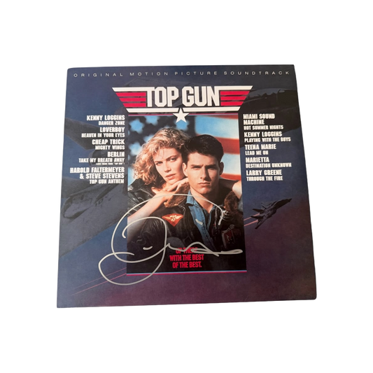 Front cover of the Top Gun original motion picture soundtrack vinyl album hand-signed by Tom Cruise in permanent marker
