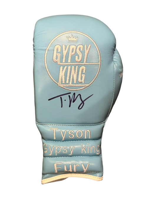 Front view of a signed Tyson Fury Gypsy King boxing glove showing autograph and logo embroidery.