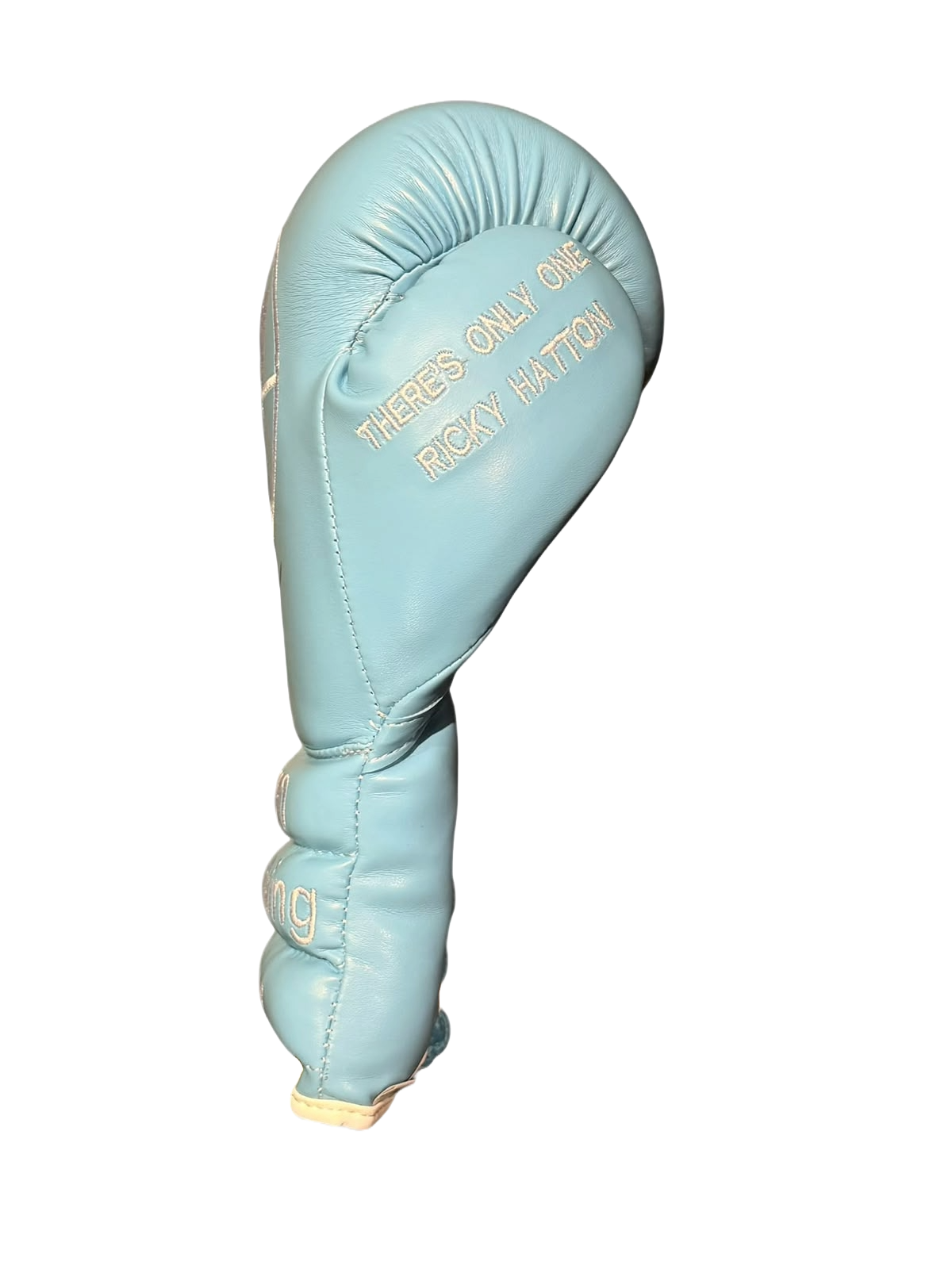 Close up view of boxing glove thumb with embroidered tribute text reading There's only one Ricky Hatton.