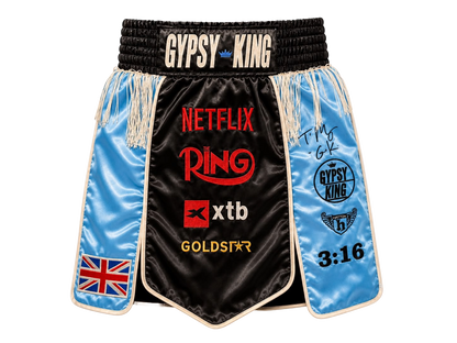 Front view of signed Tyson Fury Gypsy King boxing shorts showing the autograph and logo details.