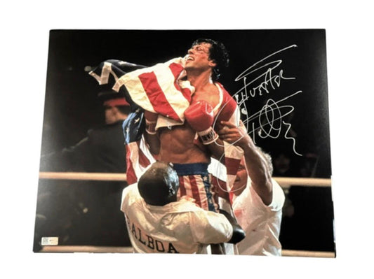Sylvester Stallone signed photograph of Rocky Balboa being lifted in victory with an American flag over his shoulders as the World Champion.
