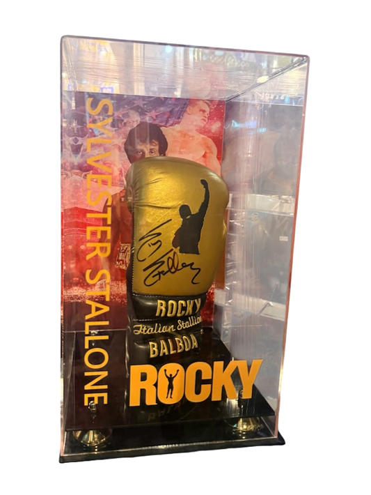 Signed Sylvester Stallone metallic gold Rocky boxing glove housed inside a custom acrylic display case, featuring a bold hand-signed autograph across the wrist
