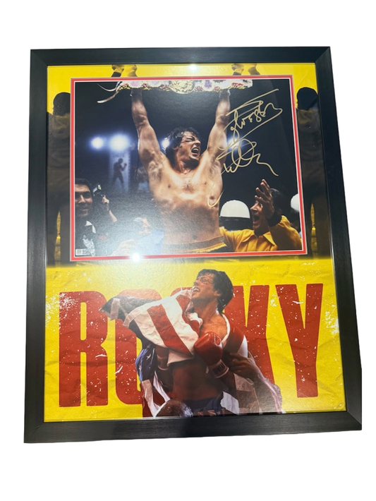 Signed Sylvester Stallone Rocky movie poster featuring a bold hand-signed autograph across the classic theatrical artwork
