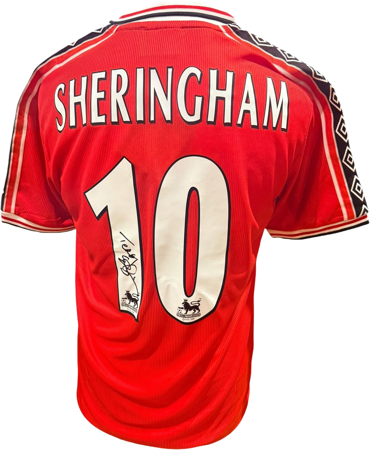 Rear view of a replica retro 1998/99 Manchester United home shirt hand-signed by striker Teddy Sheringham, displayed alongside the Certificate of Authenticity.