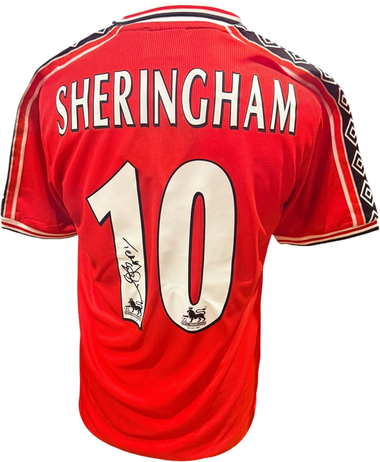 Rear view of a replica retro 1998/99 Manchester United home shirt hand-signed by striker Teddy Sheringham, displayed alongside the Certificate of Authenticity.