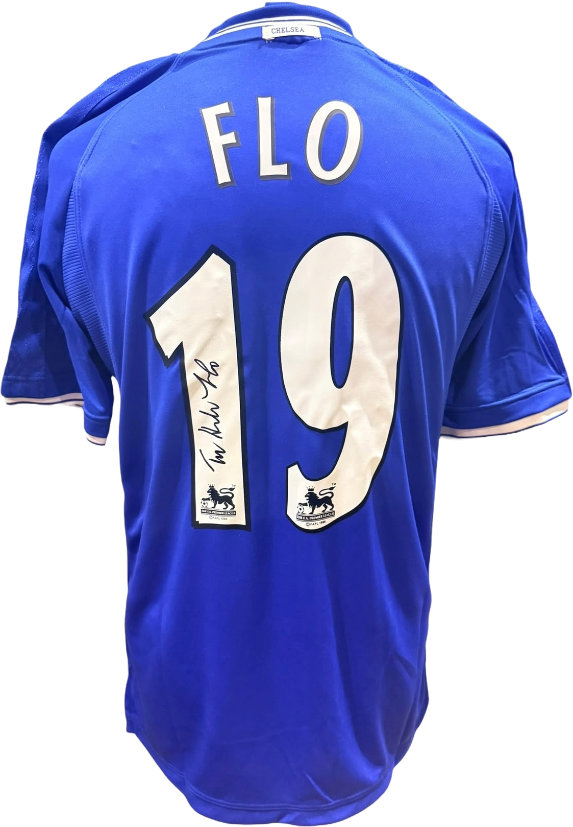 Rear view of a replica retro Chelsea home shirt hand-signed by striker Tore André Flo, displayed alongside the Certificate of Authenticity.