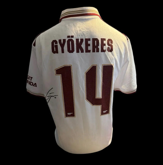 Hand-signed Viktor Gyokeres Arsenal 2025/26 white third shirt featuring official club font and Art Deco patterns.