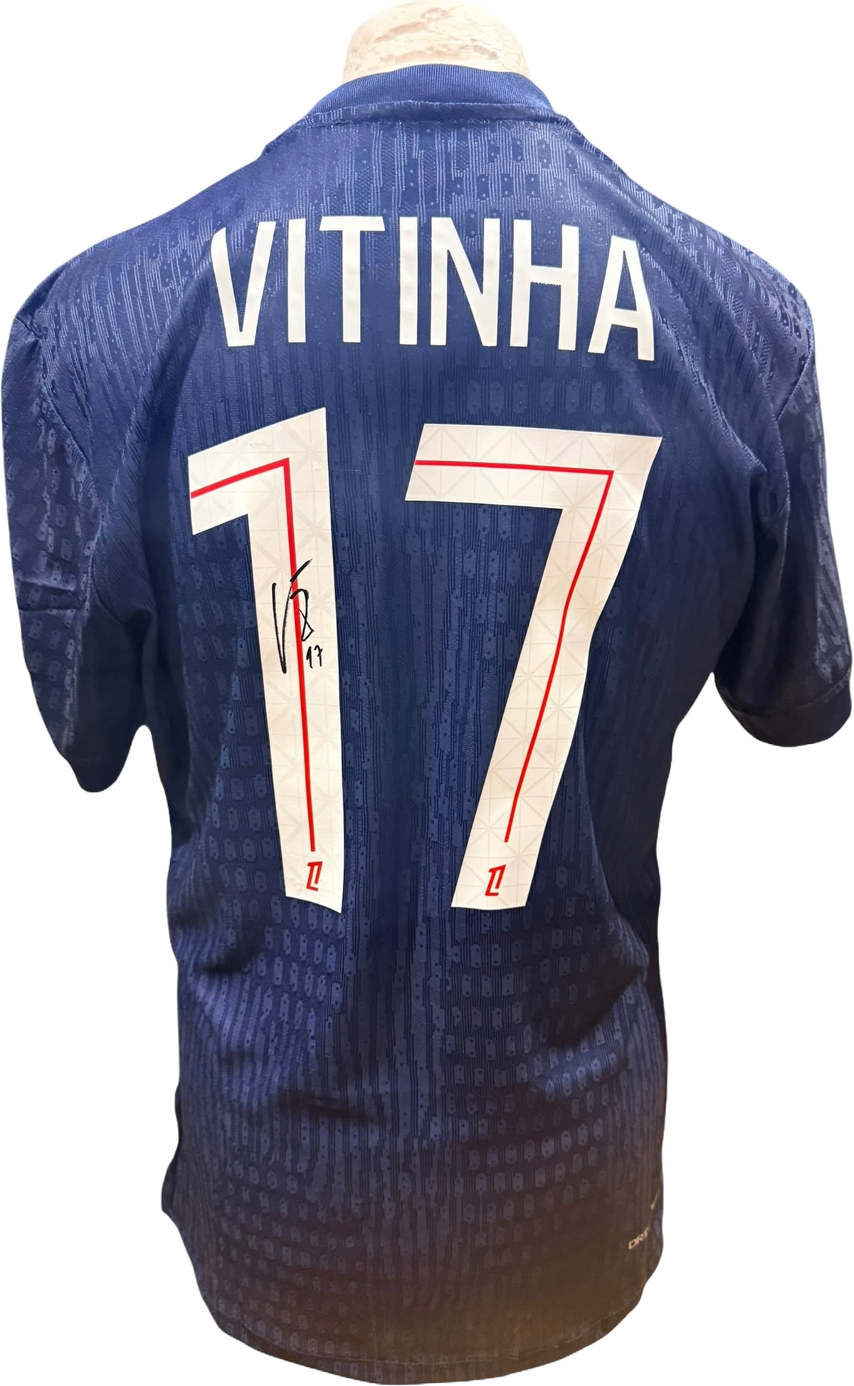 Rear view of a Paris Saint-Germain home shirt signed by Vitinha, highlighting his name, number 17, and the autograph alongside a Certificate of Authenticity.