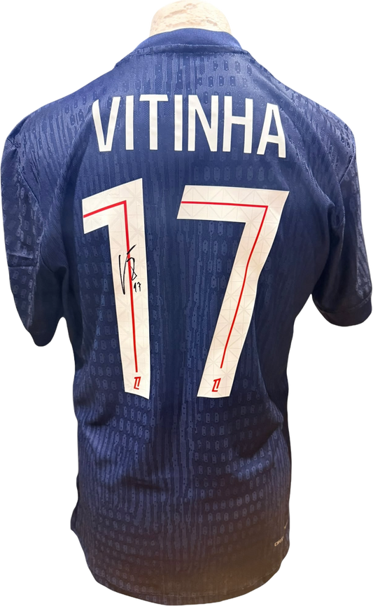 Rear view of a Paris Saint-Germain home shirt signed by Vitinha, highlighting his name, number 17, and the autograph alongside a Certificate of Authenticity.